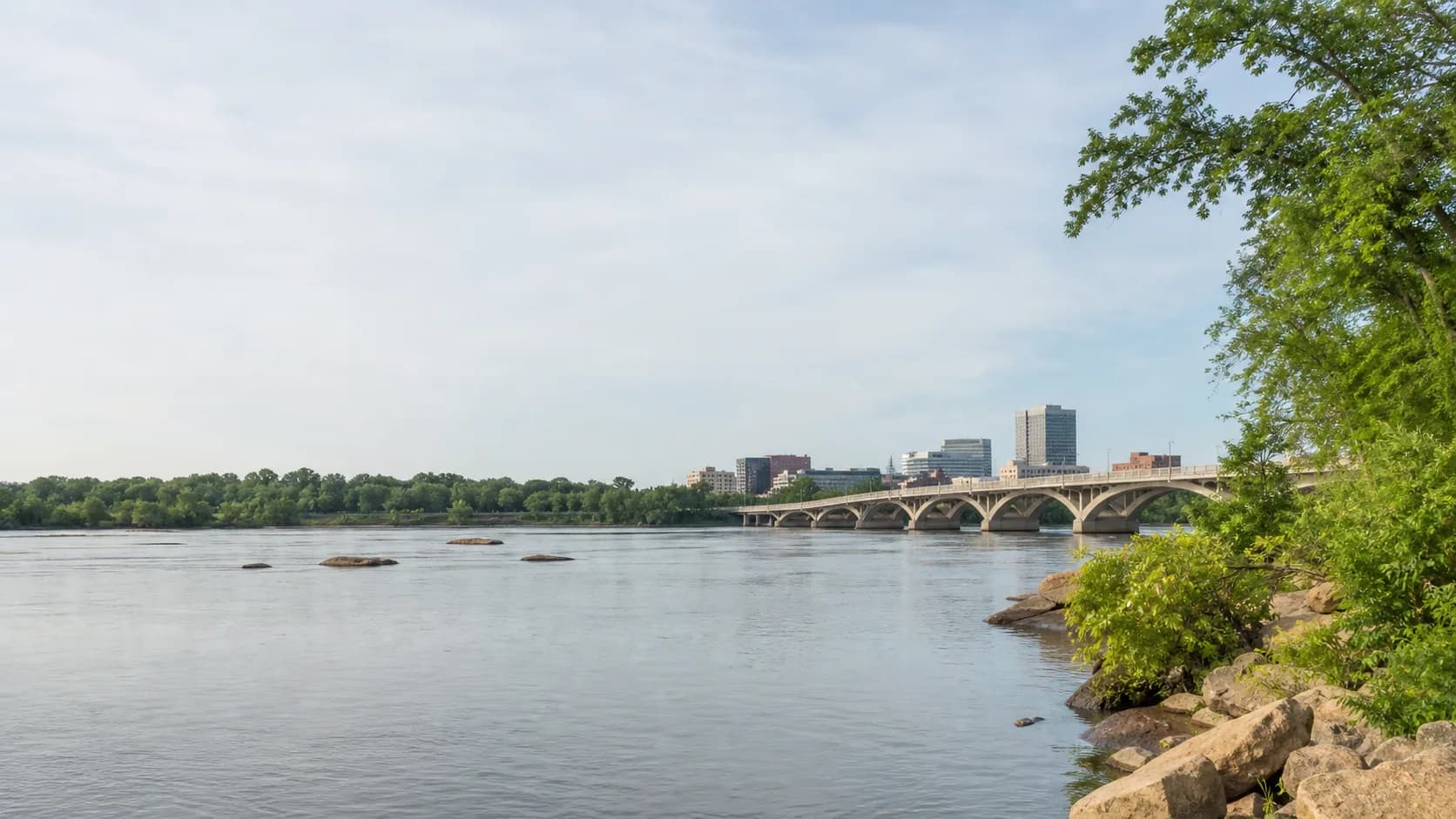 A river in Columbia, South Carolina, with a bridge and the city beyond