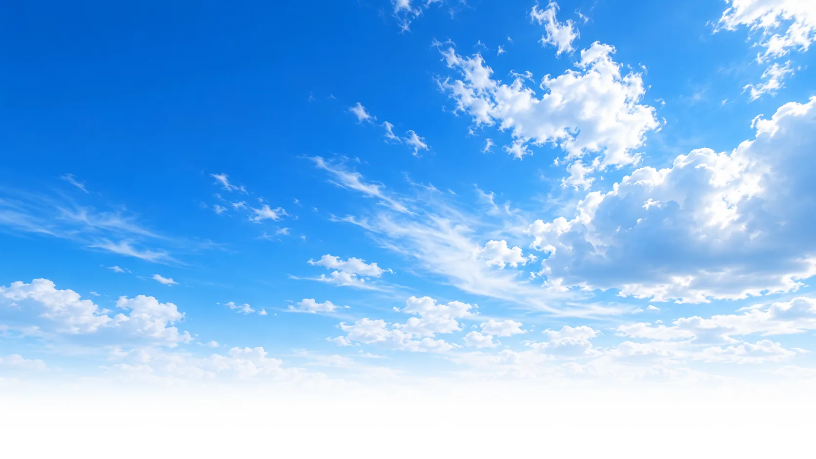 A clear, deep sky blue with bright clouds opening toward a soft cool-white horizon.